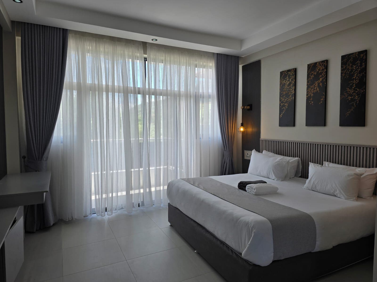 Oloisiri suite with sheer curtains and natural light